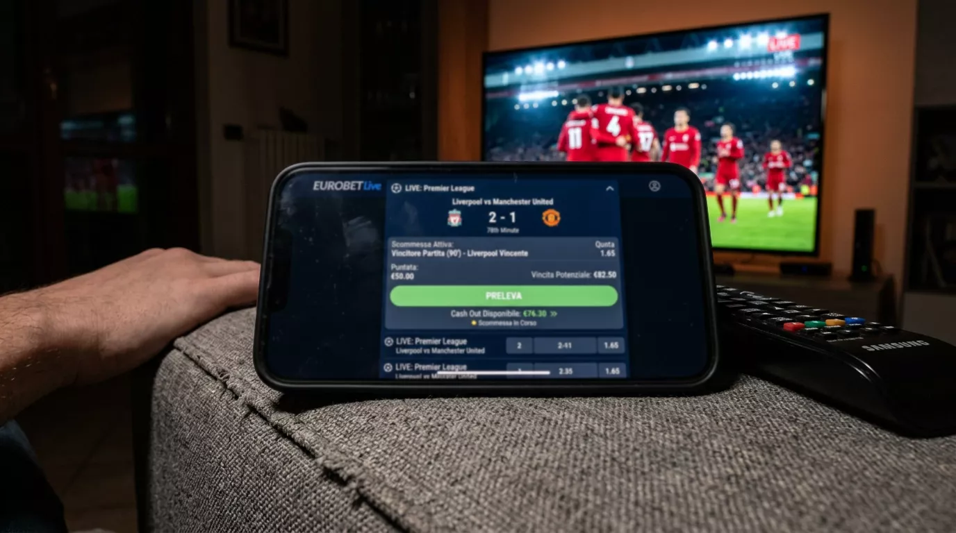 Schermo di un'app mostra l'andamento di una scommessa live durante una partita di calcio