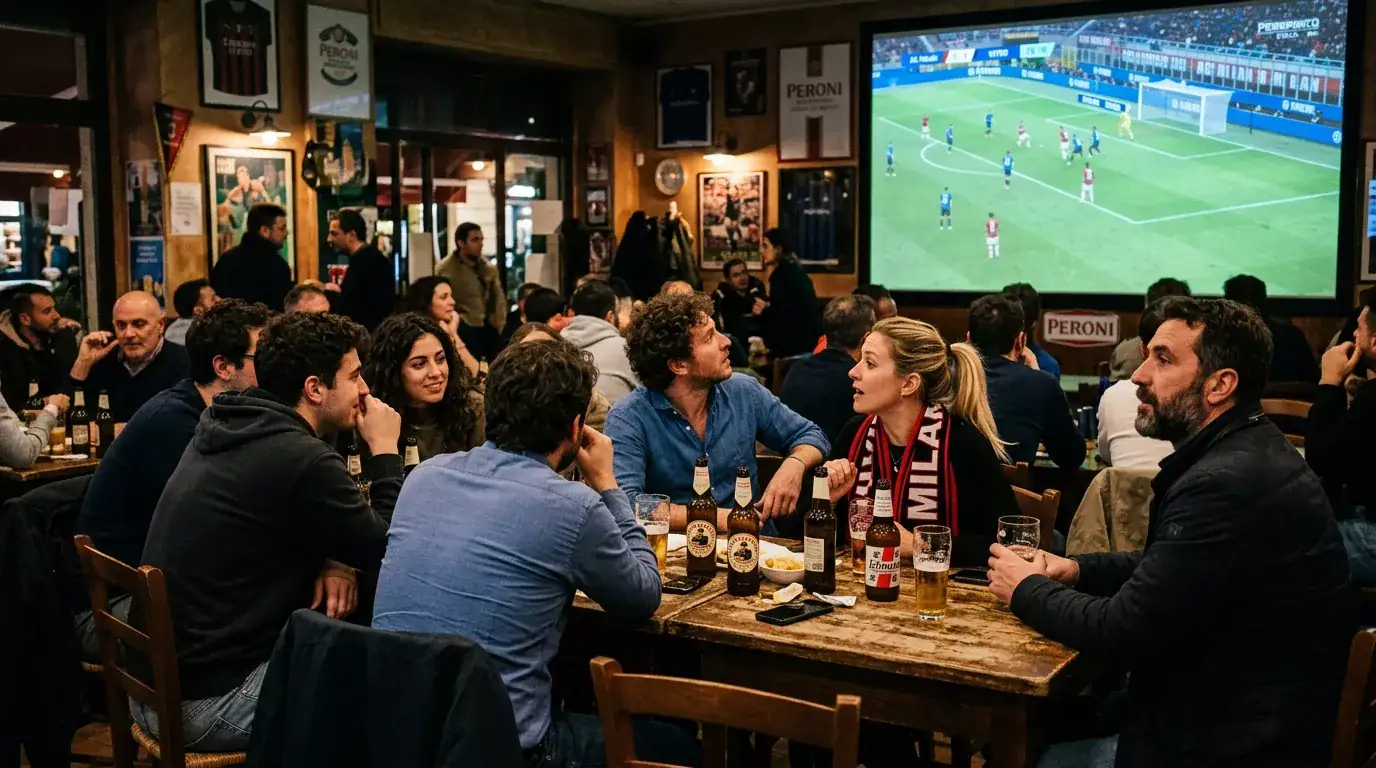Uomini e donne guardano insieme una partita di calcio su un grande schermo